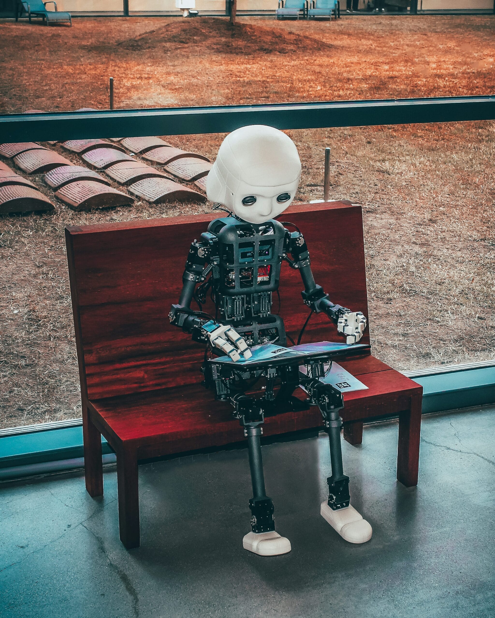 Black and white robot toy representing AI technology used in meme generators